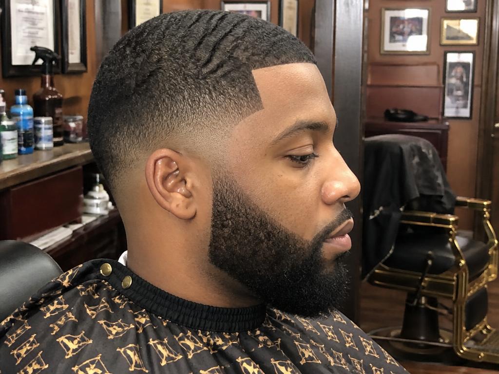 Skin fade + beard line-up